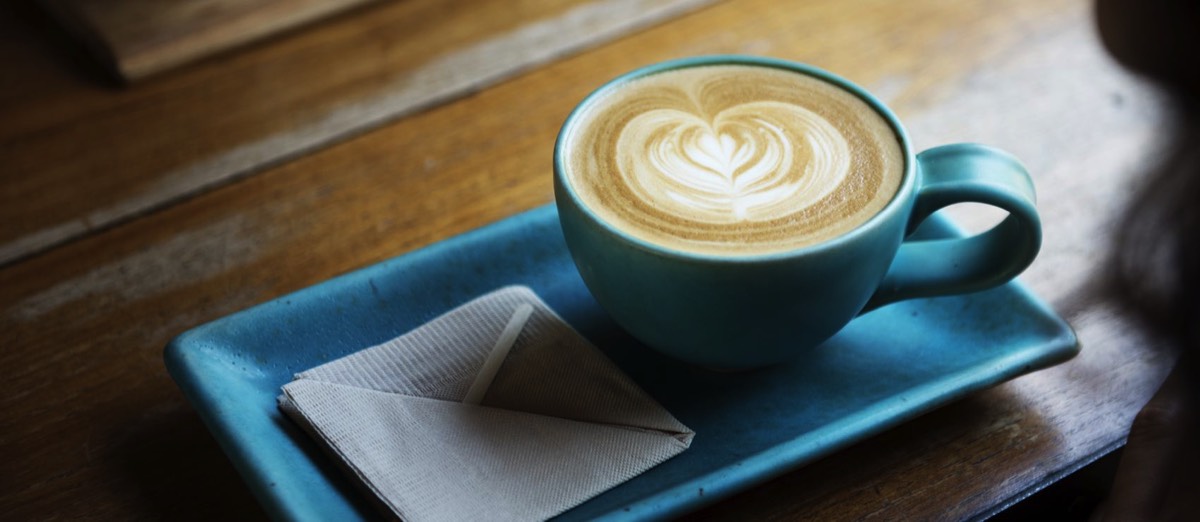 Image of a blue cup of coffee on a table